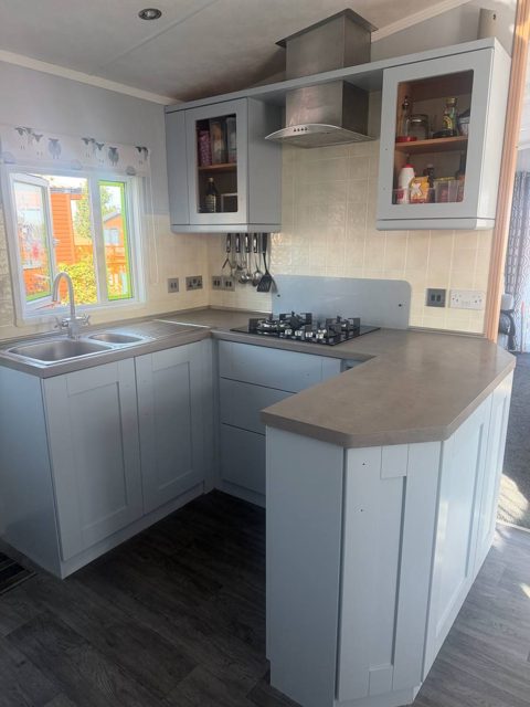 The same kitchen with the units painted a soft light grey